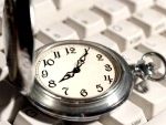 3800062-ancient-pocket-watch-on-the-computer-keyboard