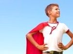 5045059-young-boy-in-a-super-hero-costume-looking-away-blue-sky-as-the-background