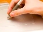 794977-working-with-tablet-hand-and-pen